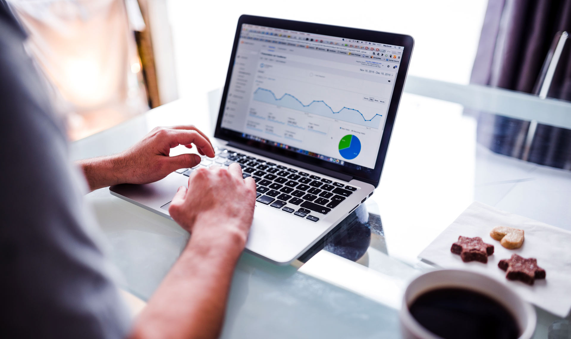 Person reviewing website analytics on a laptop