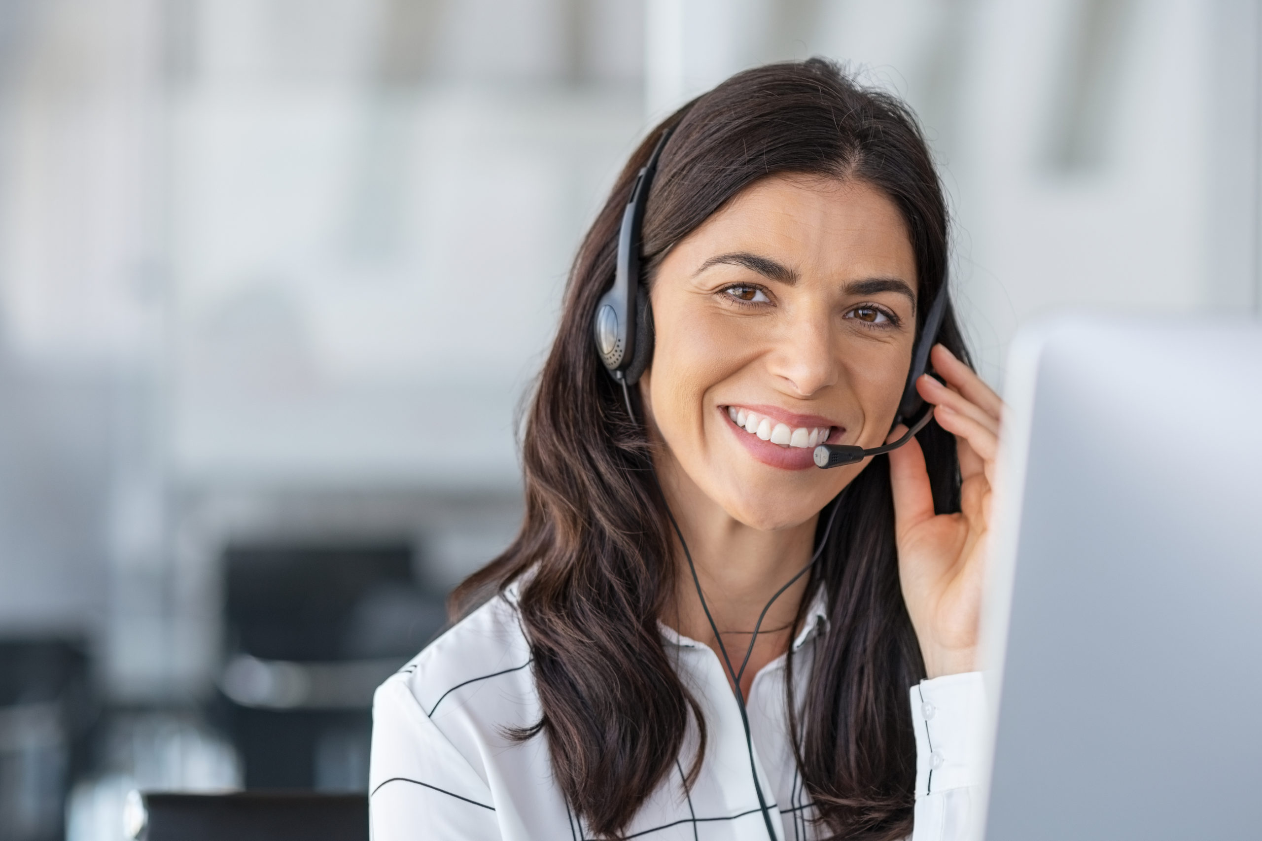 Friendly customer support agent with a headset