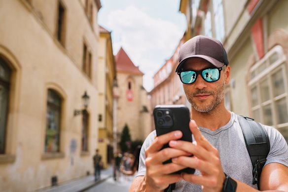 Traveller searching for tours on a smartphone